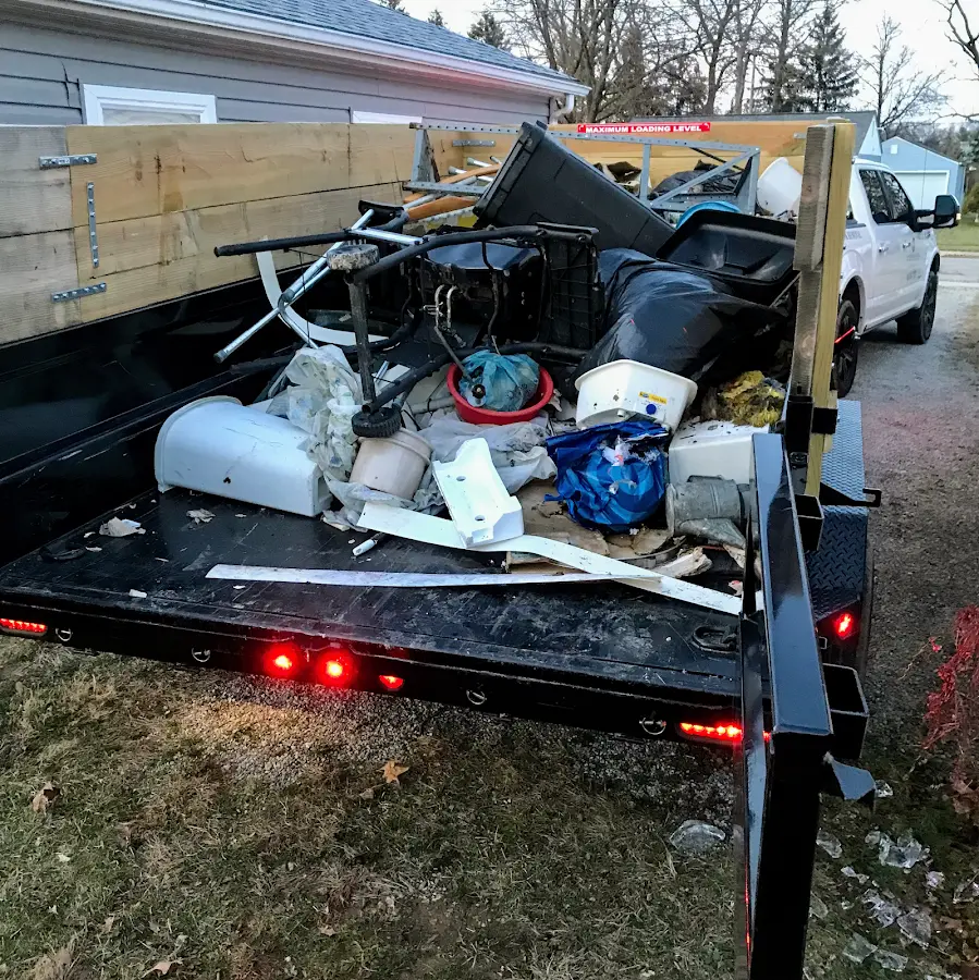 Roll-off dumpster delivered to a residential driveway in Upper